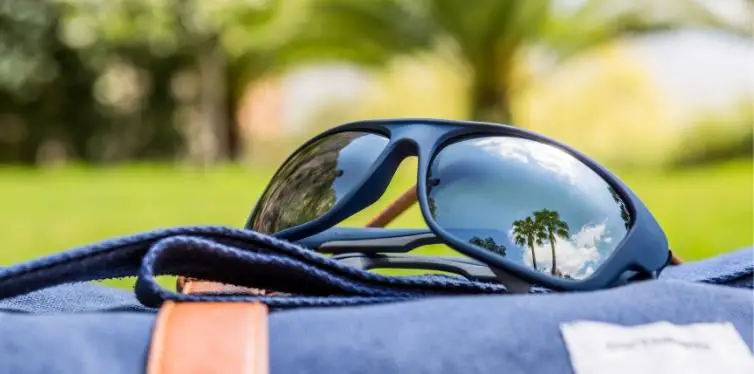 Polarized sailing sunglasses on backpack